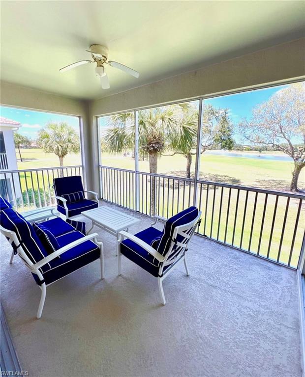 1957 Crestview Way, Unit 160 Naples, FL 34119 - Photo 14 of 32 wooden outdoor living room with furniture and a floor to ceiling window
