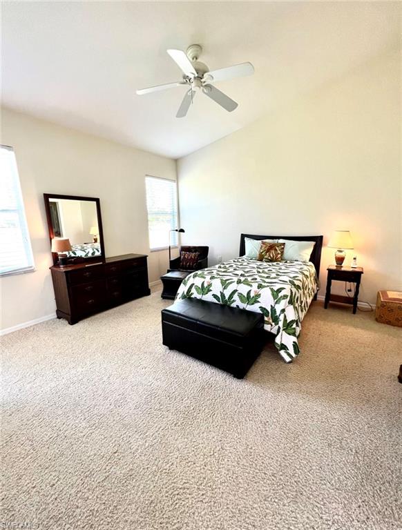 1957 Crestview Way, Unit 160 Naples, FL 34119 - Photo 17 of 32 a bed room with furniture and a couch