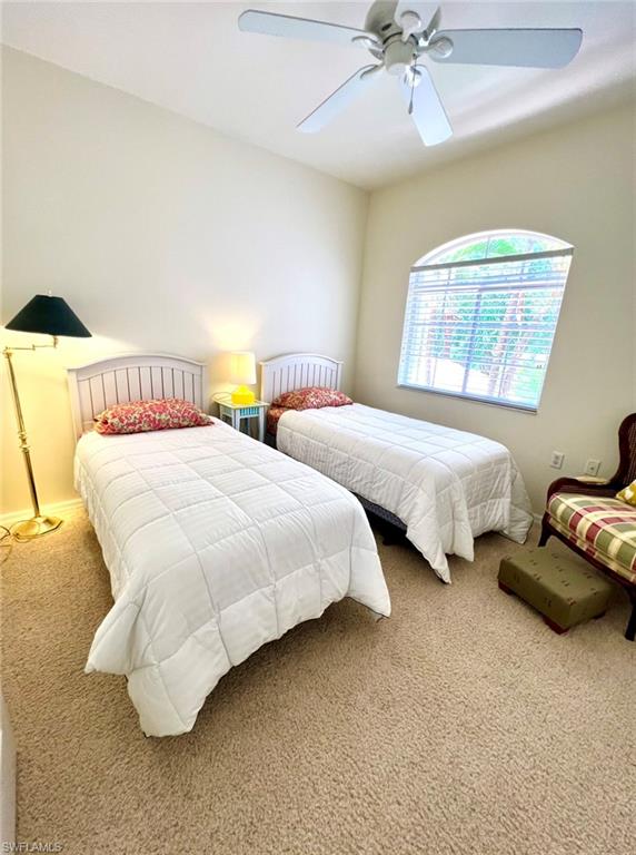 1957 Crestview Way, Unit 160 Naples, FL 34119 - Photo 21 of 32 a bedroom with two beds and painting on the wall