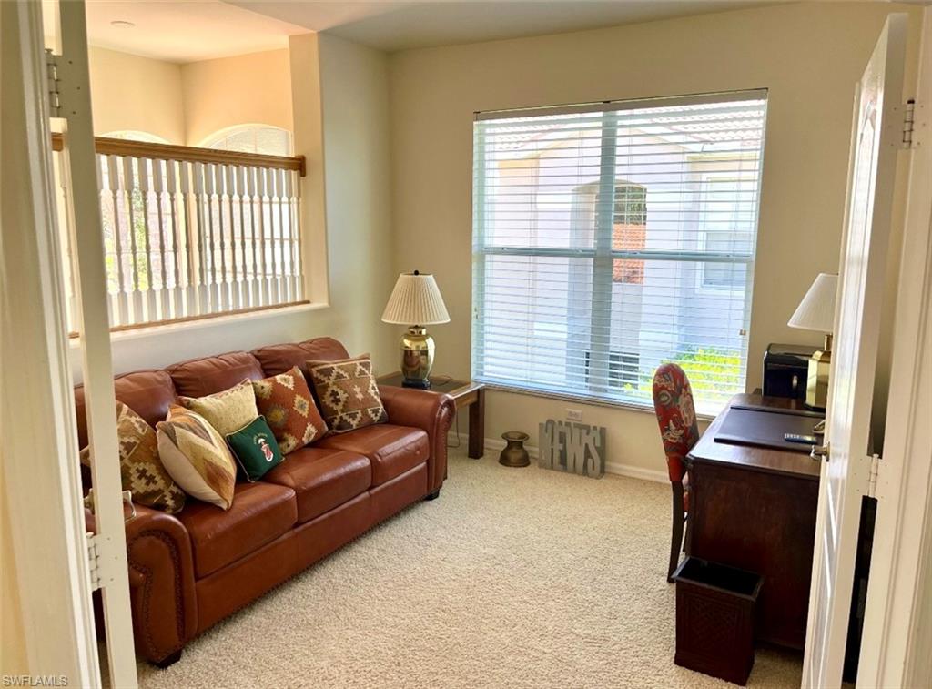 1957 Crestview Way, Unit 160 Naples, FL 34119 - Photo 23 of 32 a living room with furniture and a window