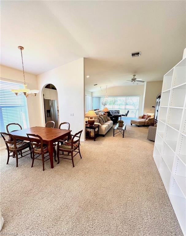 1957 Crestview Way, Unit 160 Naples, FL 34119 - Photo 3 of 32 a living room with furniture and a chandelier