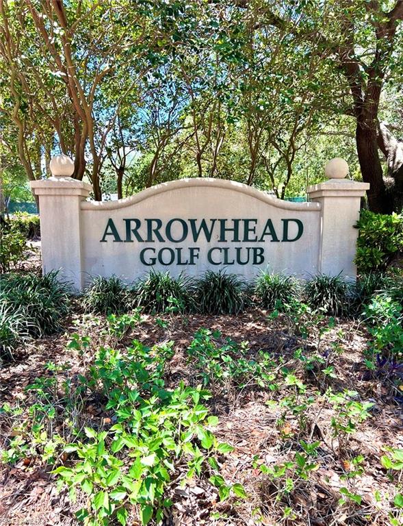 1957 Crestview Way, Unit 160 Naples, FL 34119 - Photo 32 of 32 a sign that is sitting in front of flowers