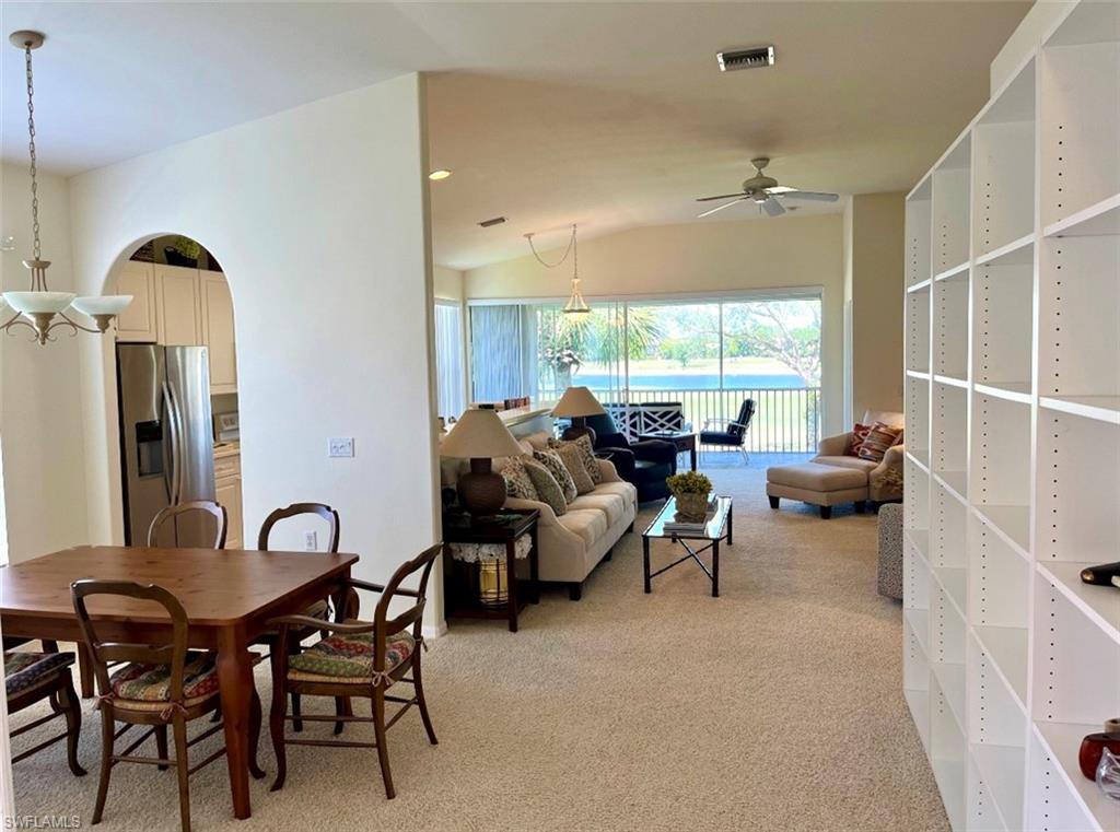 1957 Crestview Way, Unit 160 Naples, FL 34119 - Photo 4 of 32 a living room with furniture and a large window