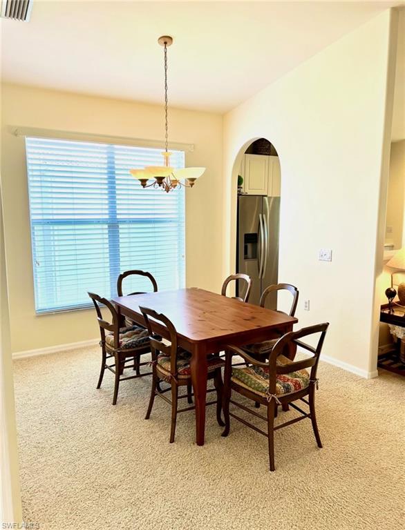 1957 Crestview Way, Unit 160 Naples, FL 34119 - Photo 5 of 32 a view of a dining table and chairs