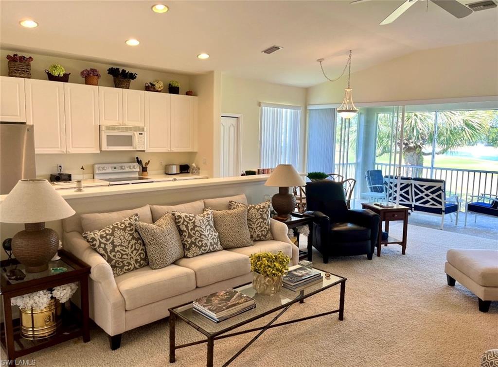 1957 Crestview Way, Unit 160 Naples, FL 34119 - Photo 8 of 32 a living room with furniture and a large window