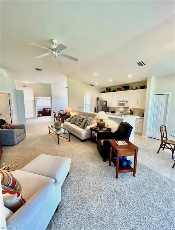1957 Crestview Way, Unit 160 Naples, FL 34119 - Photo 10 of 32 a living room with furniture and a view of kitchen