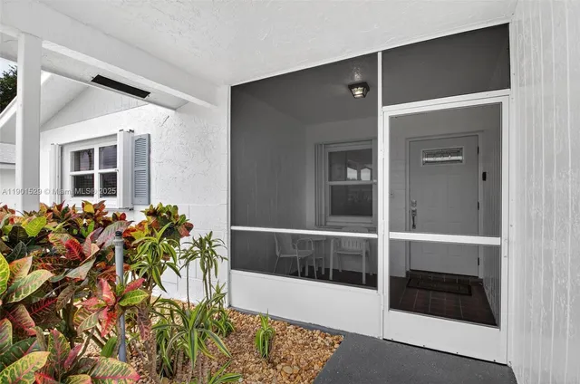 a view of a porch with a potted plant