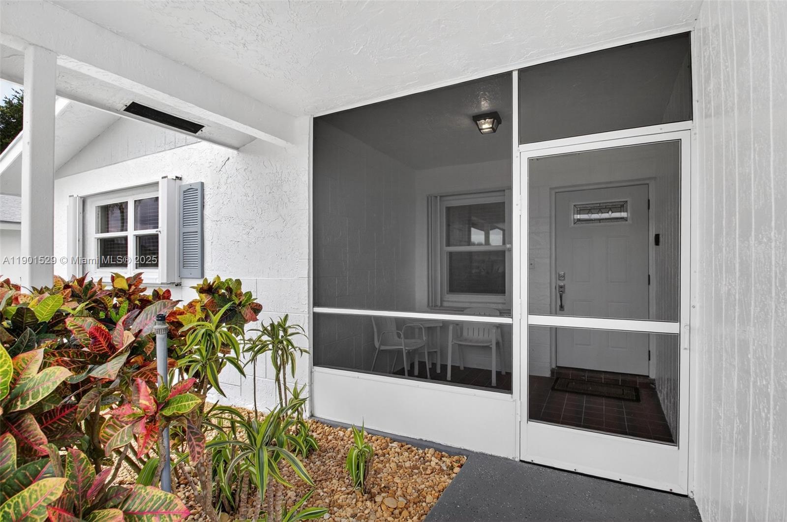 a view of a porch with a potted plant