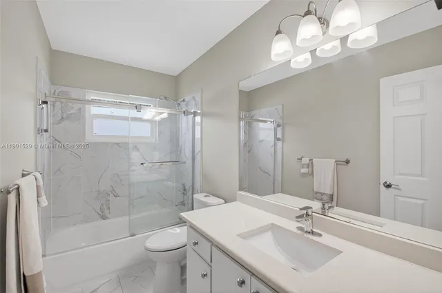 a view of a patio with a table chairs and a table