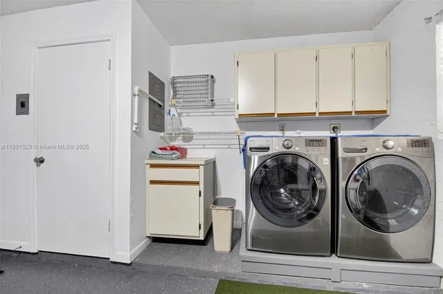 a view of a patio with a table chairs and garden