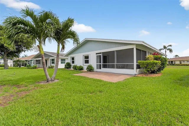a view of a lake with houses in the back
