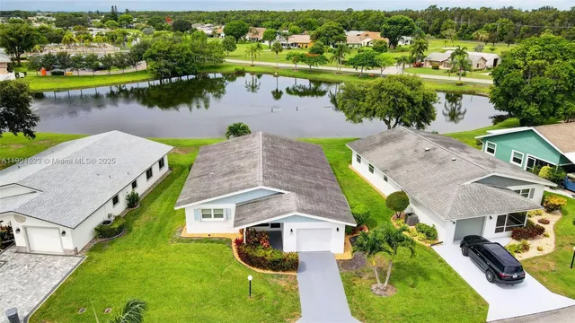 an aerial view of a house with a garden