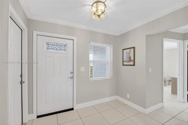 a living room with stainless steel appliances kitchen island granite countertop furniture and a view of kitchen