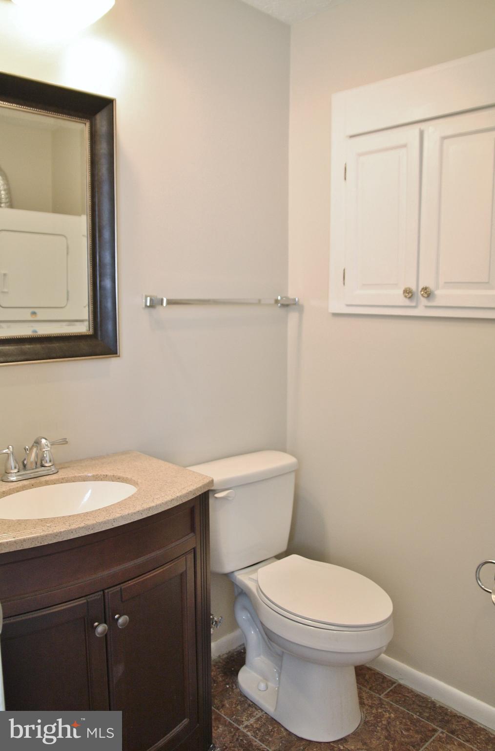 6007 Willow Spring Road, Unit D Harrisburg, PA 17111 - Photo 11 of 12 a bathroom with a sink a toilet and mirror