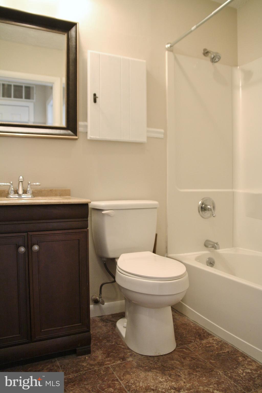 6007 Willow Spring Road, Unit D Harrisburg, PA 17111 - Photo 12 of 12 a bathroom with a sink toilet and shower