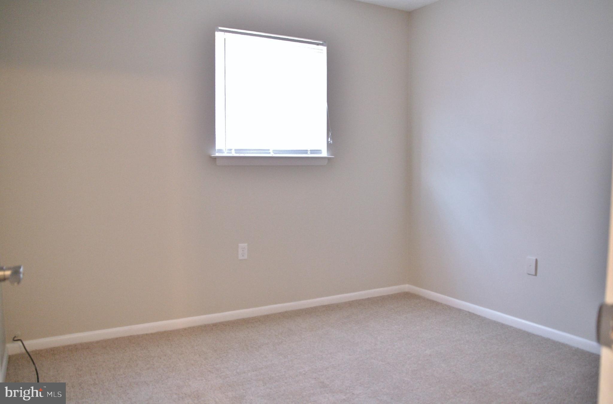 6007 Willow Spring Road, Unit D Harrisburg, PA 17111 - Photo 9 of 12 an empty room with a window
