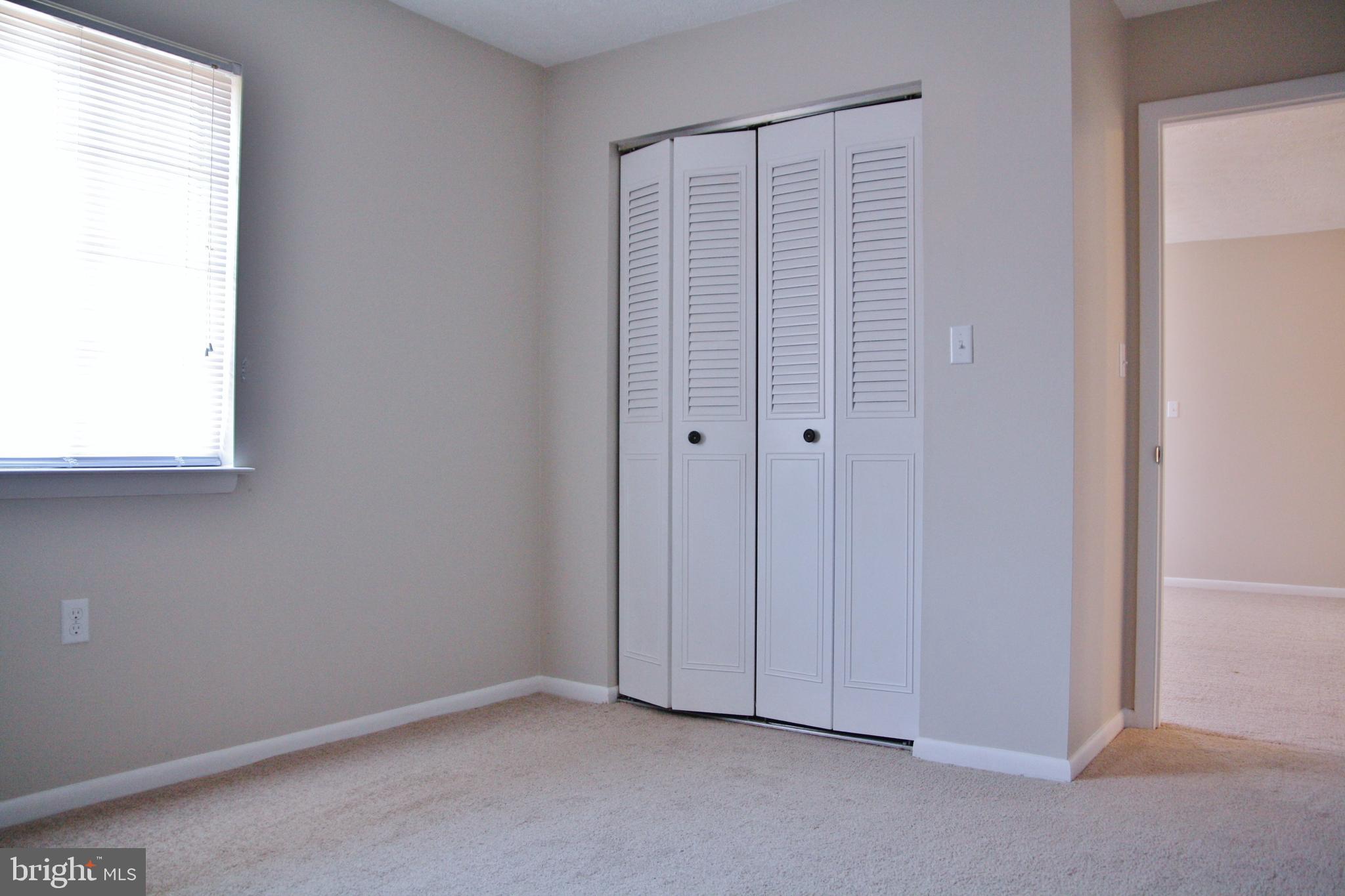 6007 Willow Spring Road, Unit D Harrisburg, PA 17111 - Photo 10 of 12 an empty room with windows