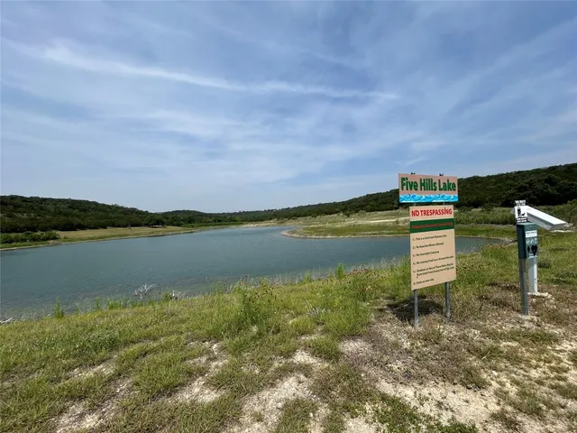 a view of a lake with a building in the background