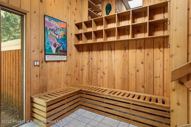 a view of wooden floor and building in the background