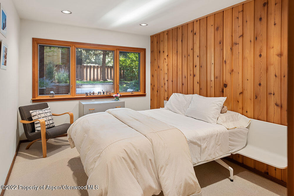 311 West North Street, Unit A Aspen, CO 81611 - Photo 18 of 39 a bedroom with a bed and a large window