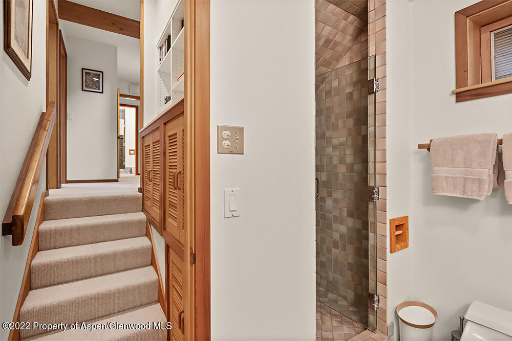 311 West North Street, Unit A Aspen, CO 81611 - Photo 20 of 39 a view of a hallway with wooden floor and door