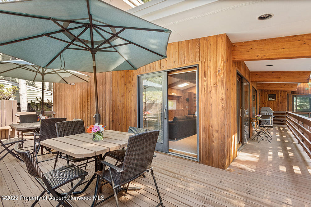 311 West North Street, Unit A Aspen, CO 81611 - Photo 27 of 39 a view of a dining table and chairs in the patio