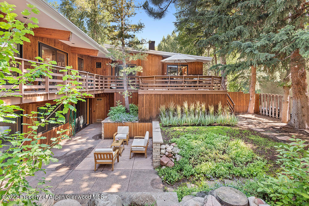 311 West North Street, Unit A Aspen, CO 81611 - Photo 29 of 39 a view of a patio with table and chairs and potted plants