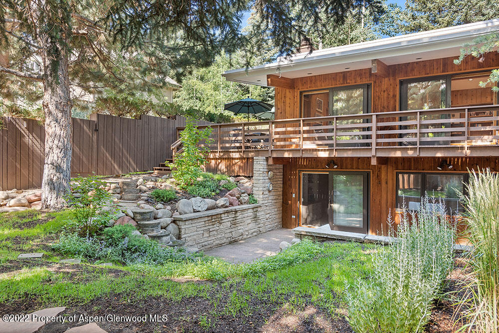 311 West North Street, Unit A Aspen, CO 81611 - Photo 30 of 39 a front view of a house with a garden