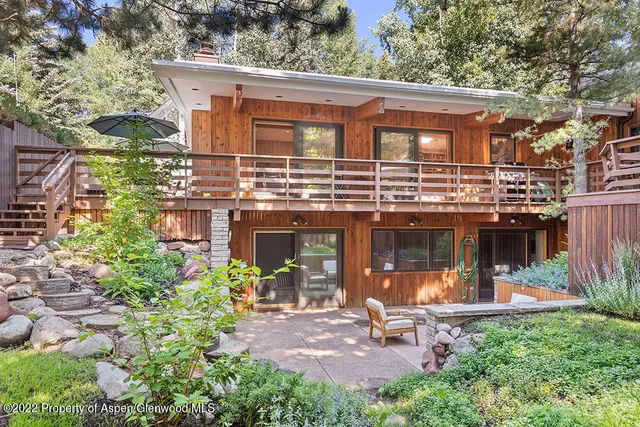 front view of a house with a garden