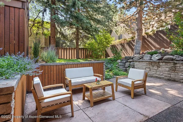 a view of a two chairs in the patio