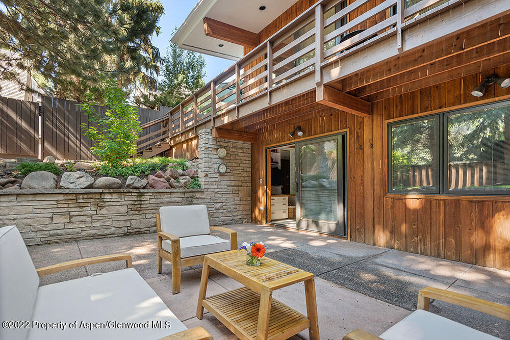 311 West North Street, Unit A Aspen, CO 81611 - Photo 35 of 39 a backyard of a house with sofas