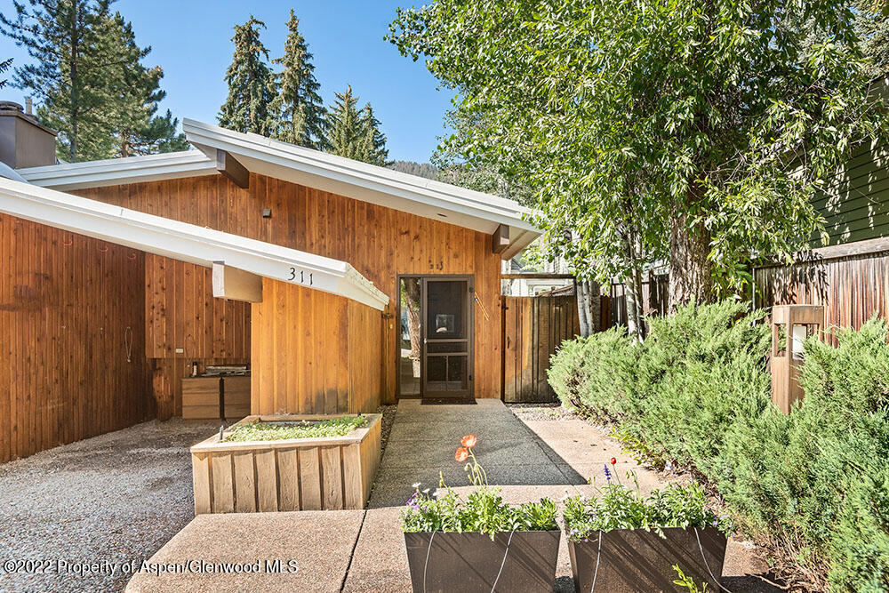 311 West North Street, Unit A Aspen, CO 81611 - Photo 37 of 39 a front view of a house with garden
