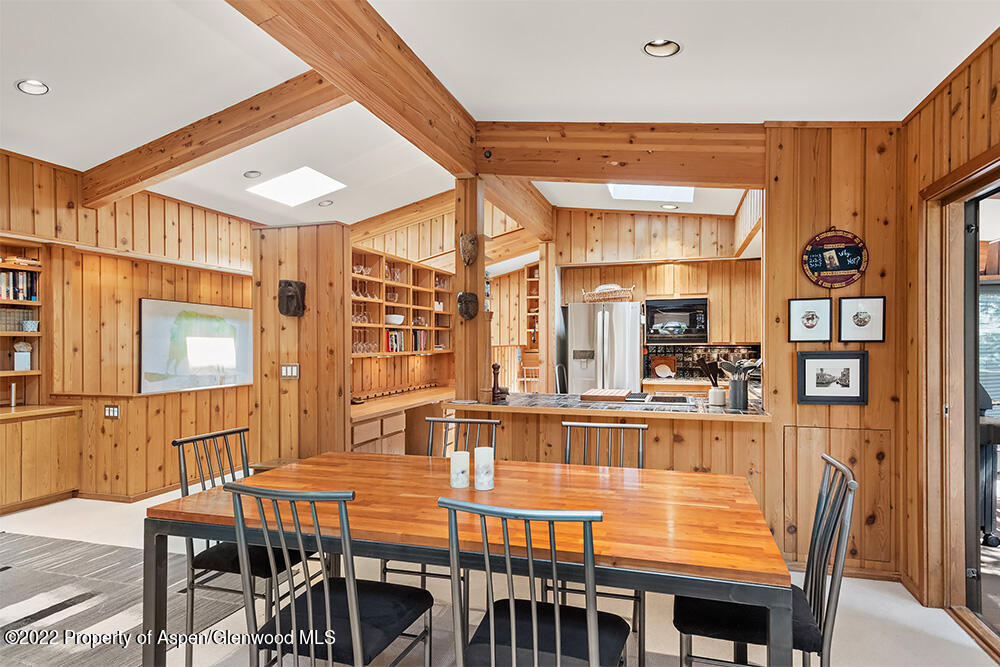 311 West North Street, Unit A Aspen, CO 81611 - Photo 5 of 39 a dining room with furniture and wooden floor