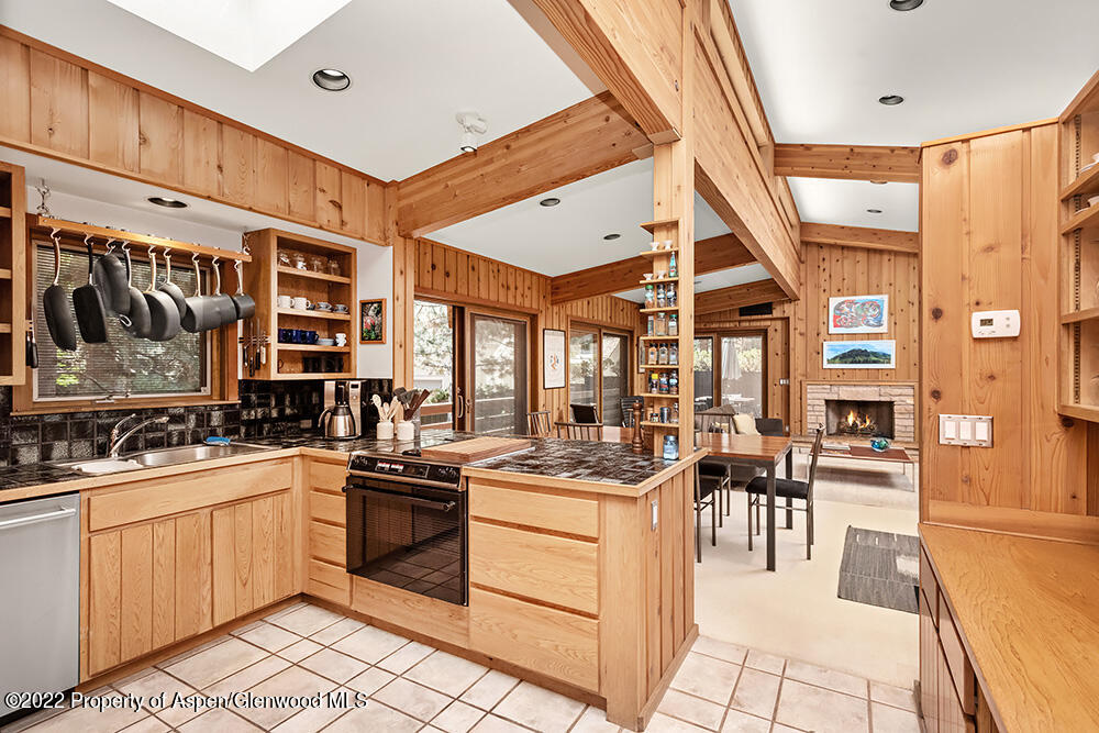311 West North Street, Unit A Aspen, CO 81611 - Photo 9 of 39 a kitchen with a sink stove and cabinets