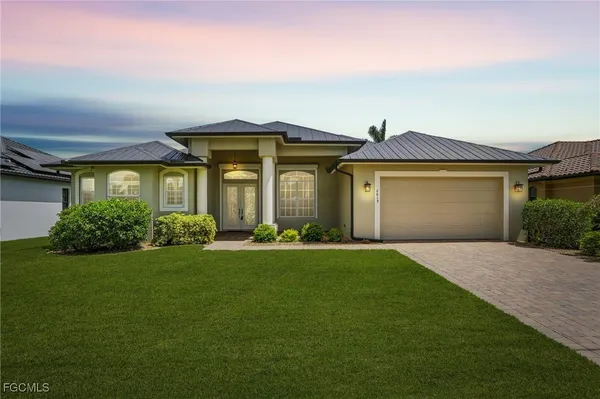 front view of a house with a garden