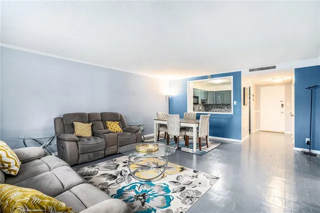 a living room with furniture and a table