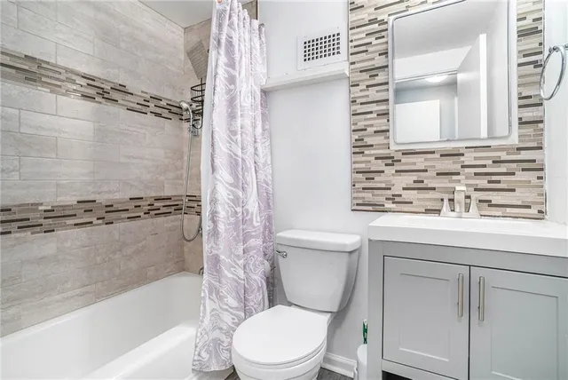 a bathroom with a toilet a sink and a bathtub