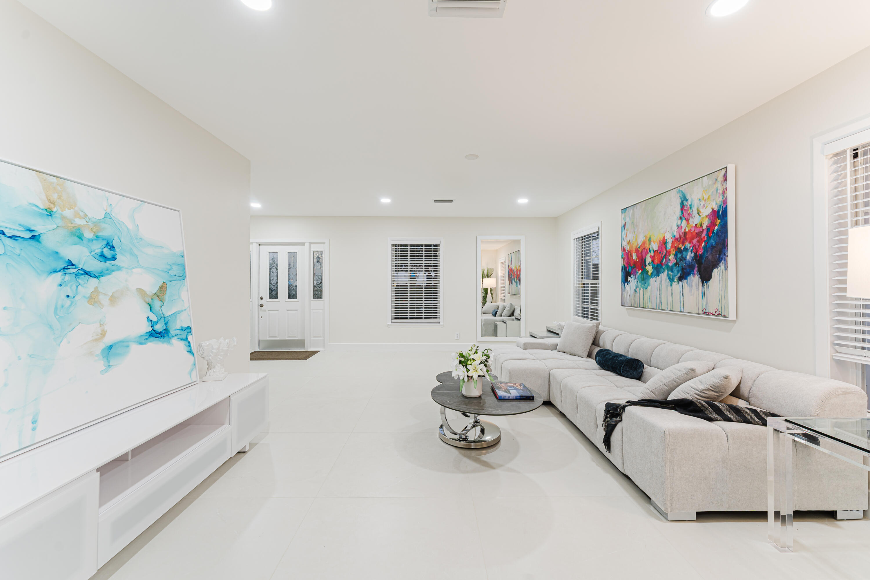 3199 Northeast 6th Drive Boca Raton, FL 33431 - Photo 12 of 49 a living room with furniture and wall paintings