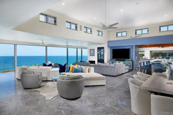 a living room with furniture and flat screen tv