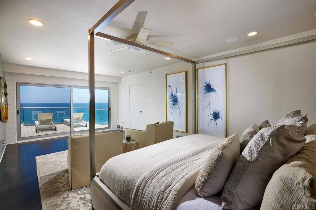 806 4th Street Encinitas, CA 92024 - Photo 18 of 47 a bedroom with a bed and glass walk in closet