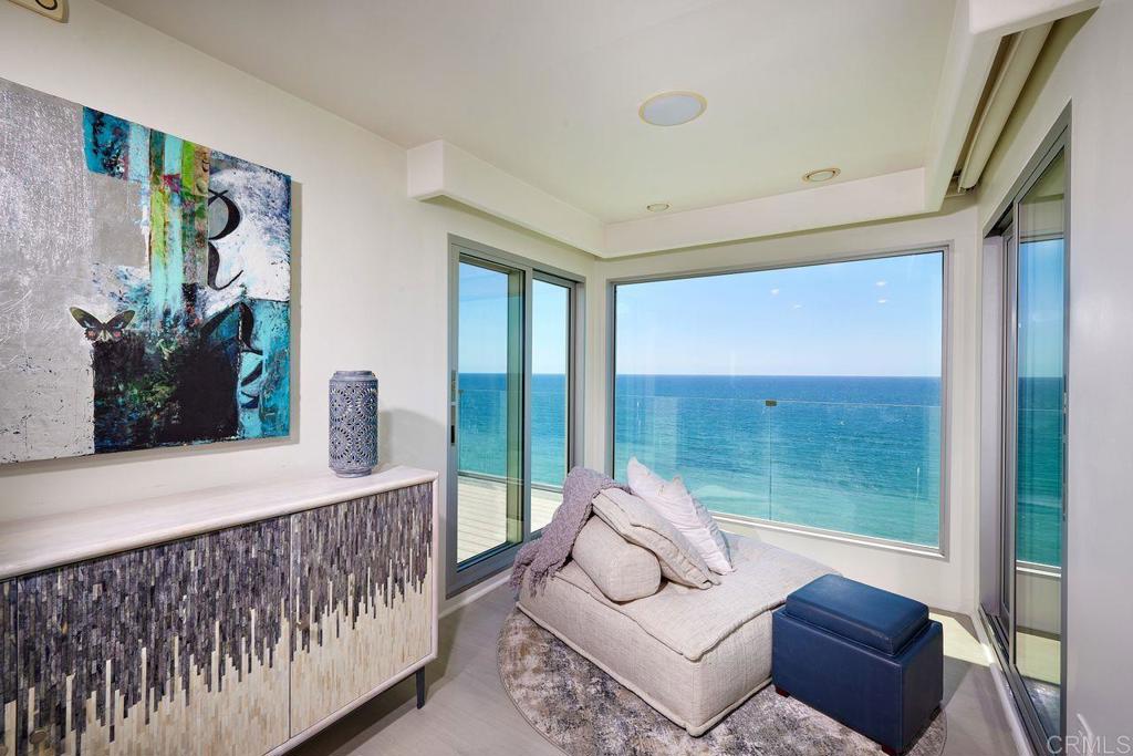 806 4th Street Encinitas, CA 92024 - Photo 28 of 47 a living room with furniture and a floor to ceiling window