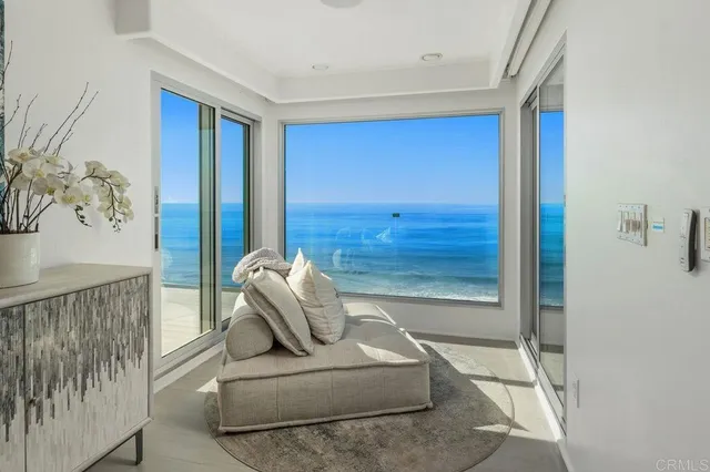 a bathroom with a granite countertop sink a toilet a mirror and shower