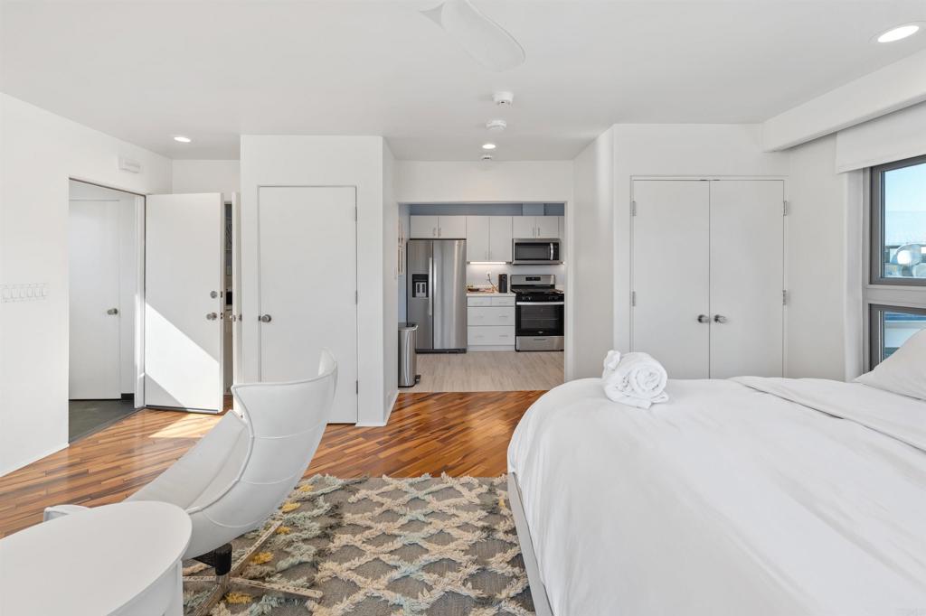 806 4th Street Encinitas, CA 92024 - Photo 36 of 47 a bedroom with a bed and a refrigerator