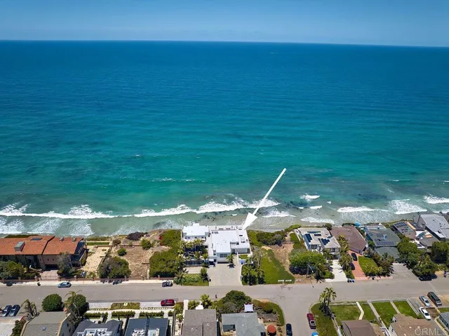 a view of a terrace with lawn chairs