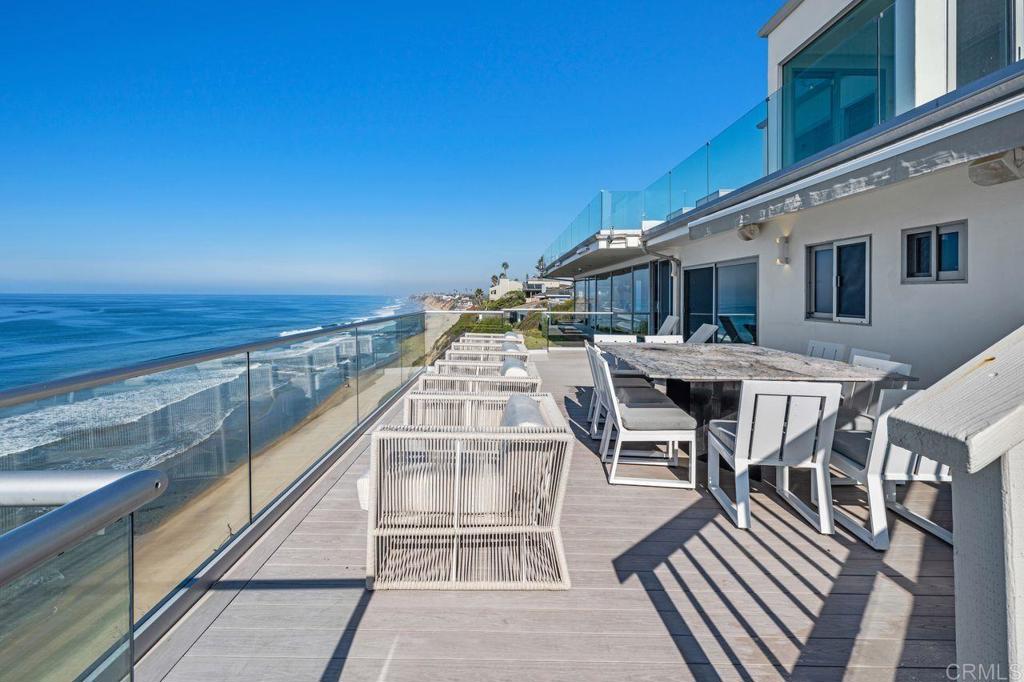 806 4th Street Encinitas, CA 92024 - Photo 44 of 47 a view of a roof deck with dining table and chairs with wooden floor