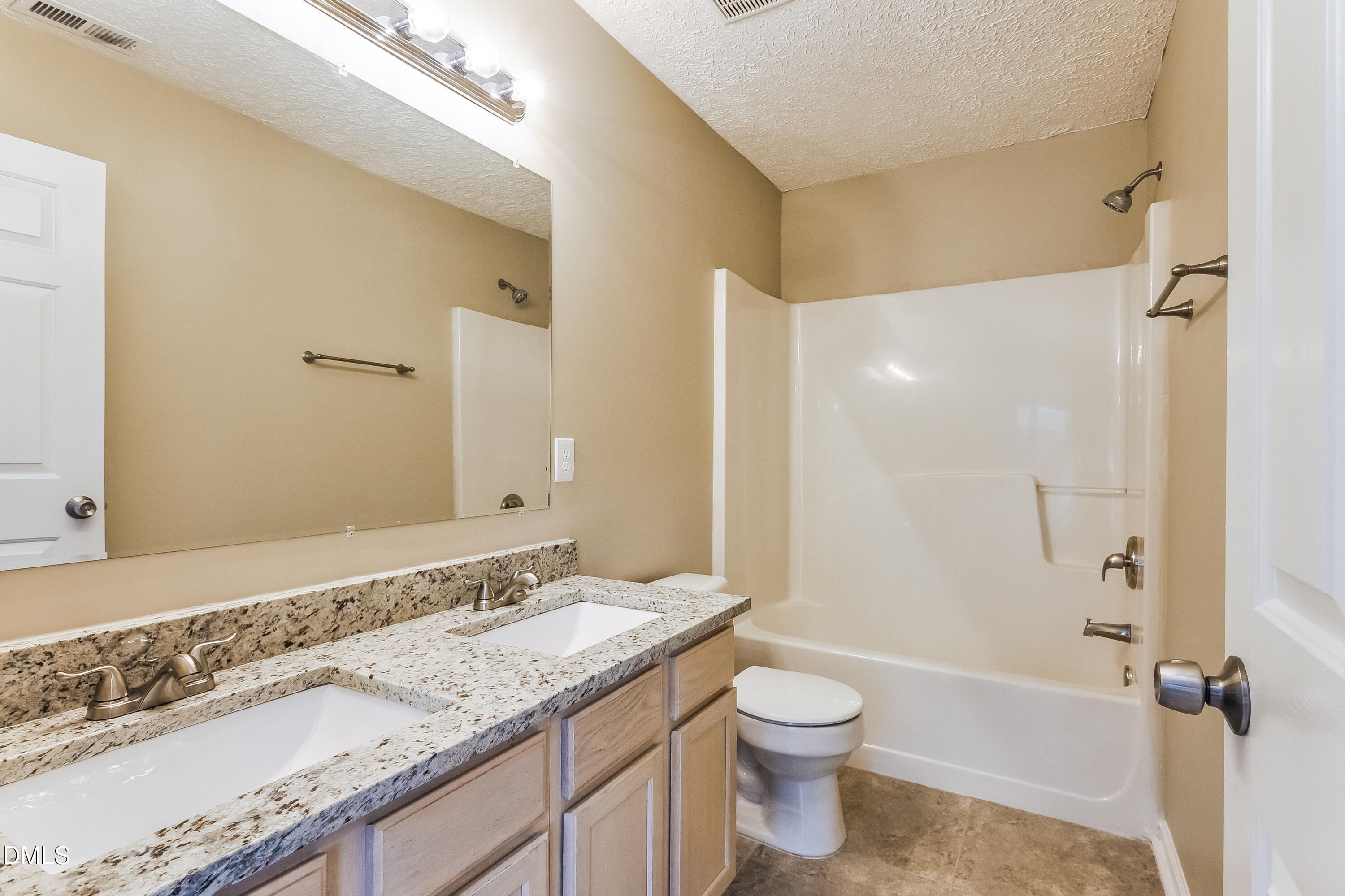 3619 Sana Court Durham, NC 27713 - Photo 11 of 15 a bathroom with a granite countertop sink toilet and shower