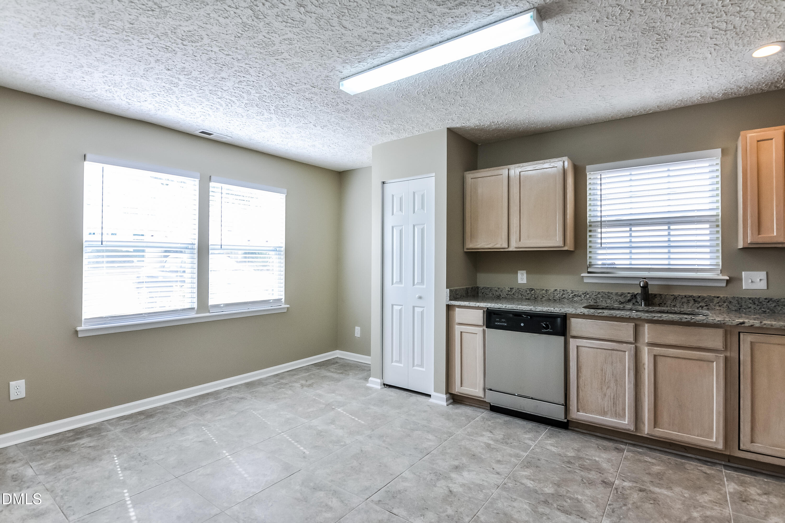 3619 Sana Court Durham, NC 27713 - Photo 7 of 15 a view of a kitchen with granite countertop cabinets and stainless steel appliances