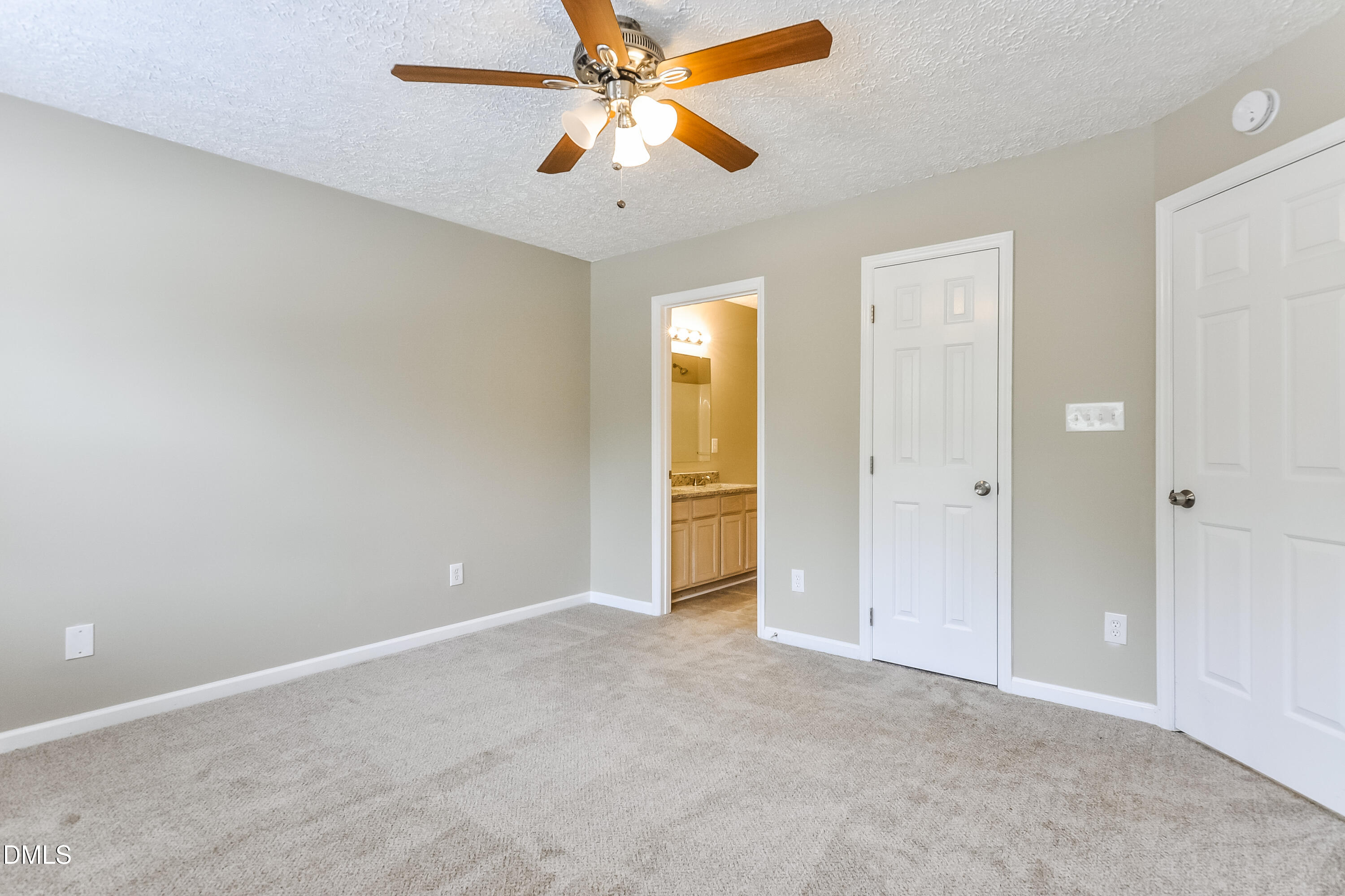 3619 Sana Court Durham, NC 27713 - Photo 10 of 15 an empty room with closet and a chandelier fan