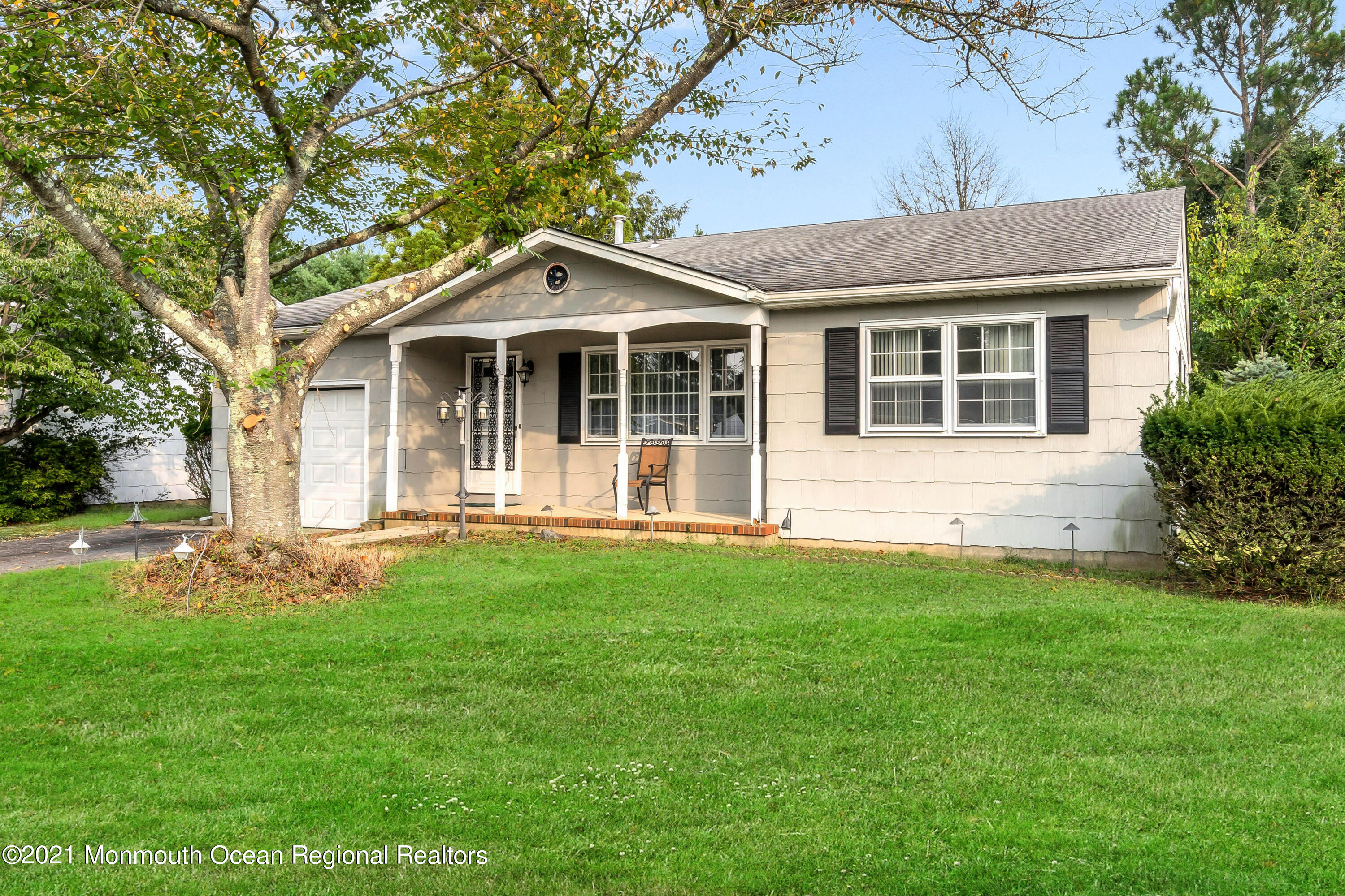 105 Georgetown Road Toms River, NJ 08757 - Photo 1 of 35 a front view of a house with a garden
