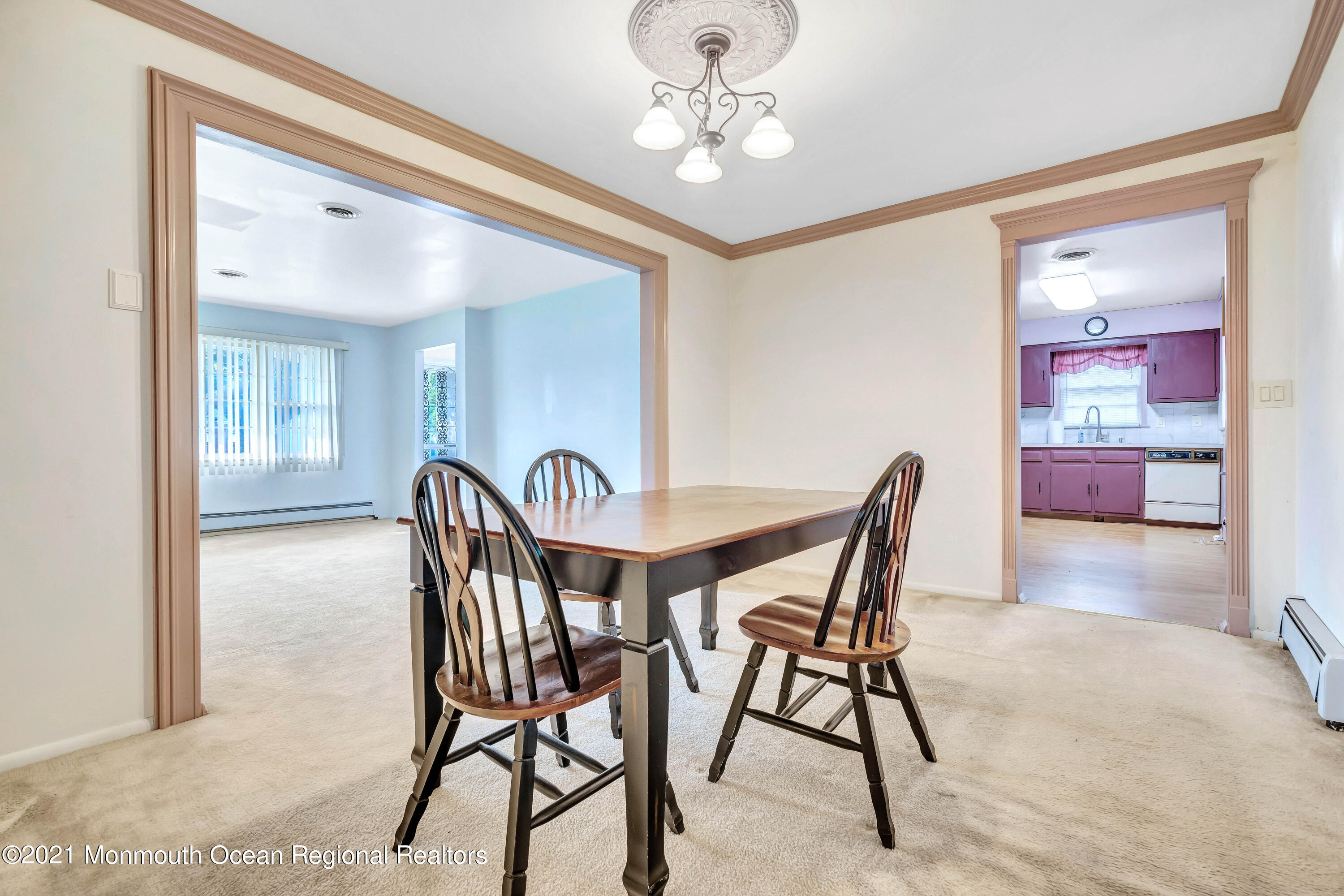 105 Georgetown Road Toms River, NJ 08757 - Photo 14 of 35 a view of a dining room with furniture and a chandelier